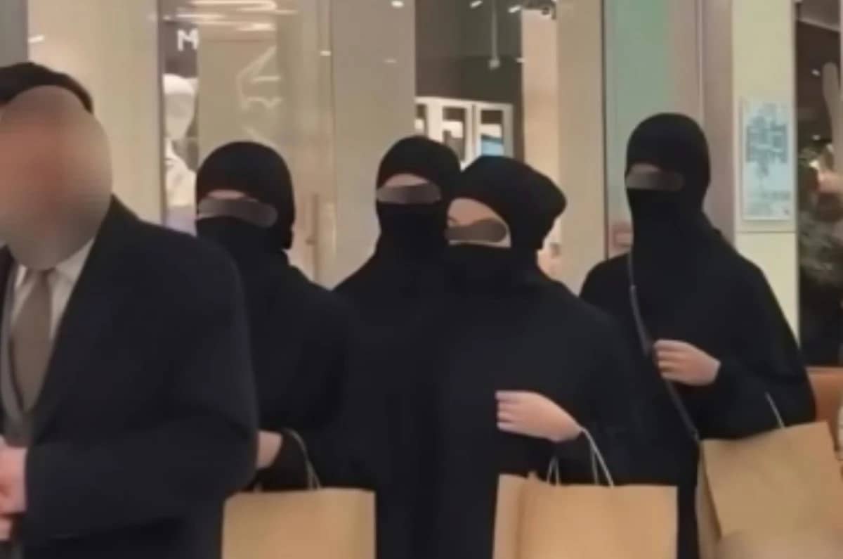 Video of a man leading several women in niqabs in Almaty sparks heated online debate